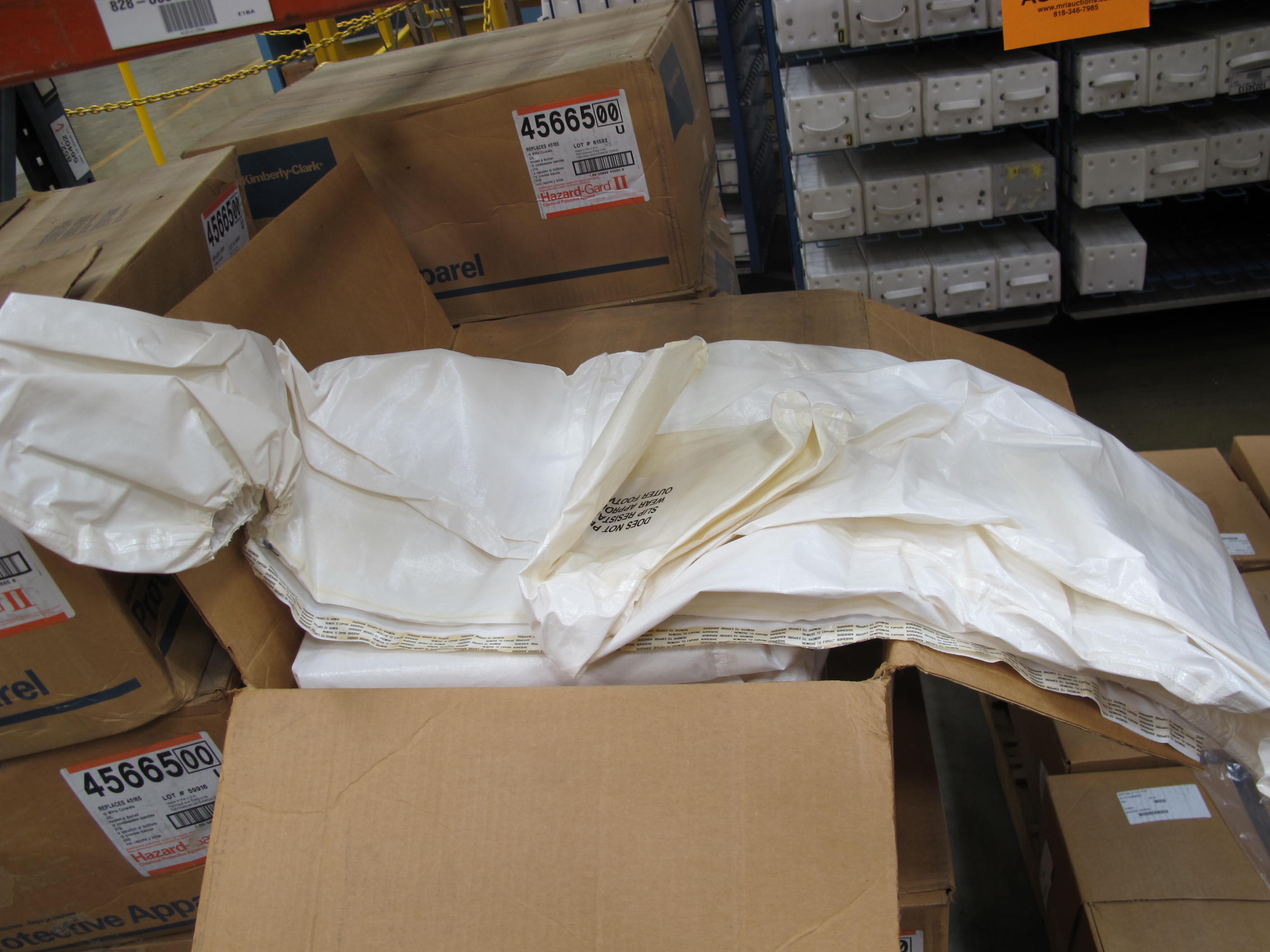 LOT TO INCLUDE: (132) COVERALLS, EXTRA EXTRA LARGE SIZE, HAZARDOUS/CHEMICAL PROTECTION KIND, SARANEX-LAMINATED POLYPROPYLENE W/TAPED SEAMS MATERIAL, WHITE COLOR, (10) BAGS, 12" X 16" X 2 MIL THICK SIZE, SAMPLE KIND, CLEAR PLASTIC MATERIAL. LOADING & HANDLING FEE $15-4218